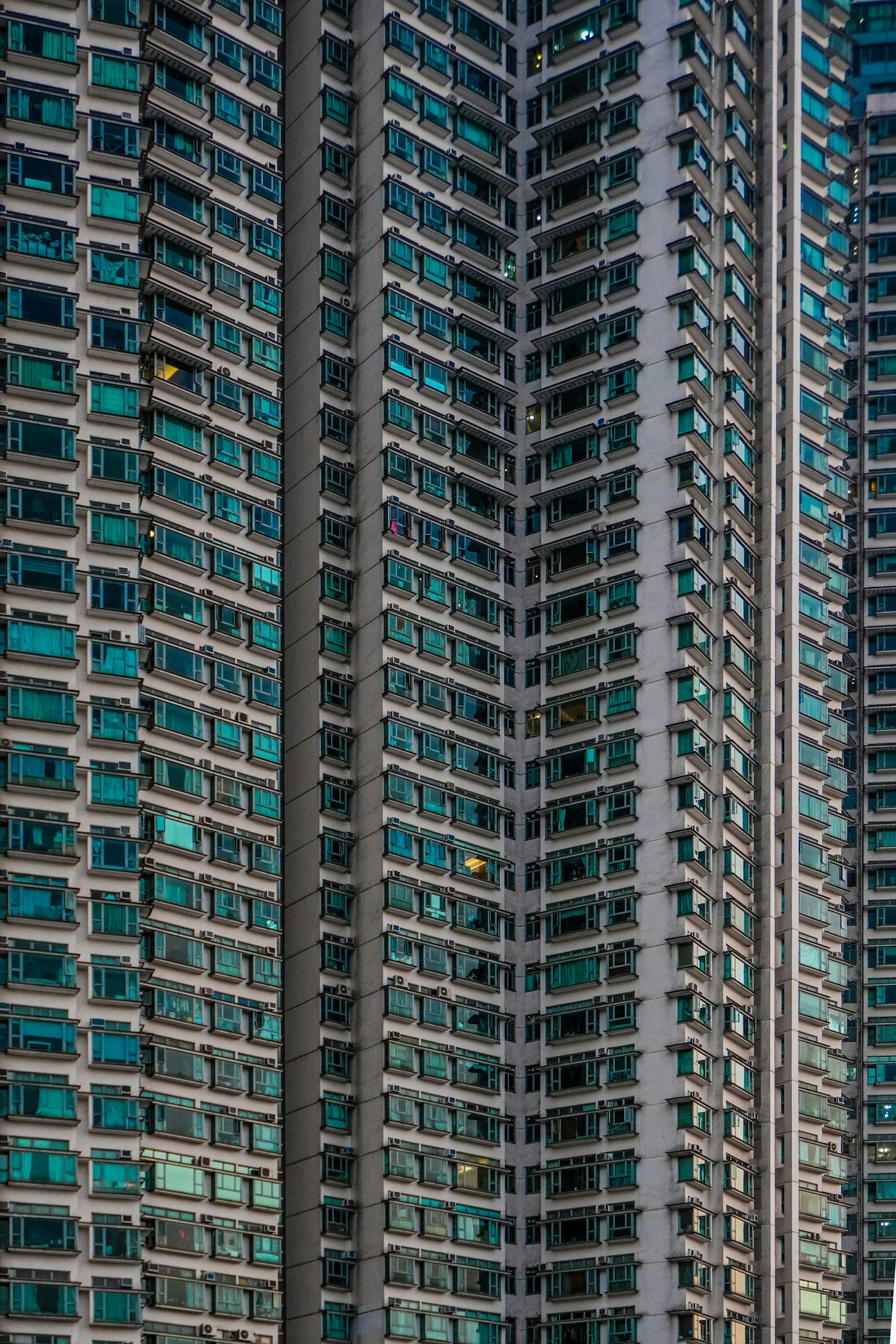 High-rise residential façades with repeating windows and balconies.